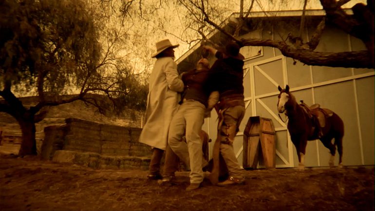 (Photo courtesy of Stage Ham Entertainment. The hay bales were used to cover the town set and increase the usage of the location.)