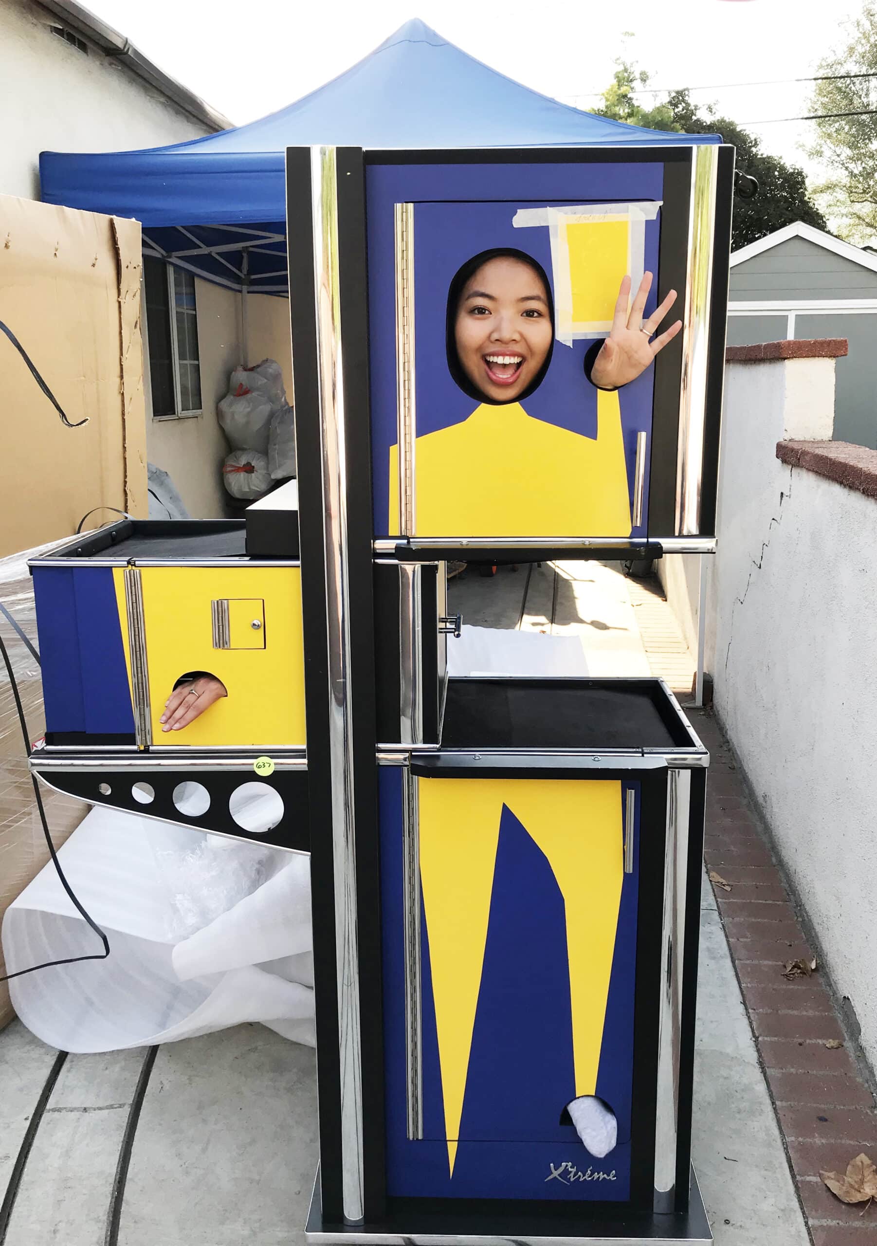 This is a photograph of Michael Goi ASC's assistant Tanya Lim in his ZigZag Magic Cabinet.